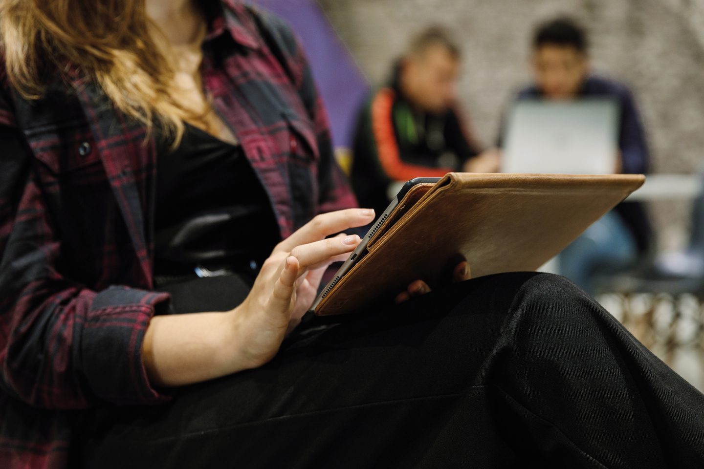 A student working on her tablet