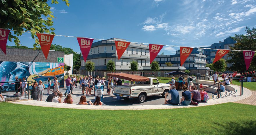 Students at Bournemouth University Talbot campus with open day decoration