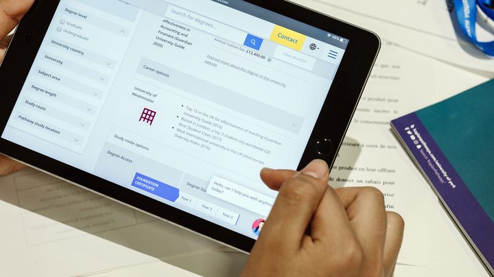 A student using the Kaplan Pathways degree finder on her tablet
