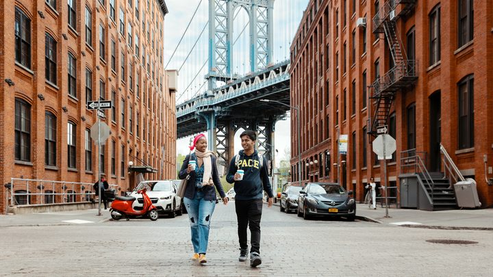 Pace University students walking near Williamsburg bridge