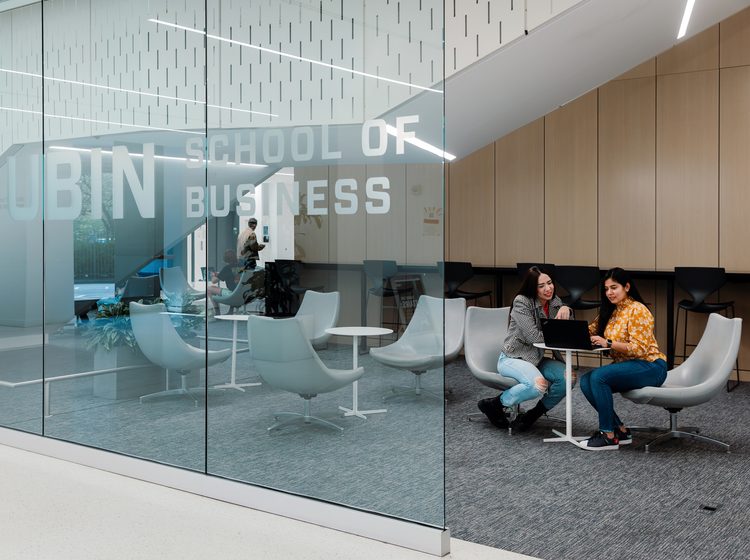 Two Pace University students in a discussion at the Lubin School of Business building