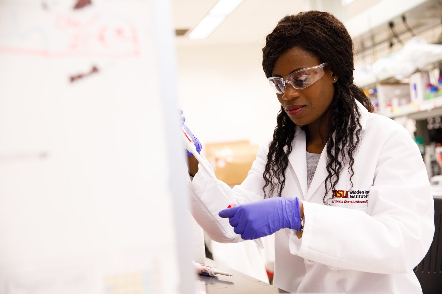 ASU student working in a lab in the Biodesign Institute at Tempe campus