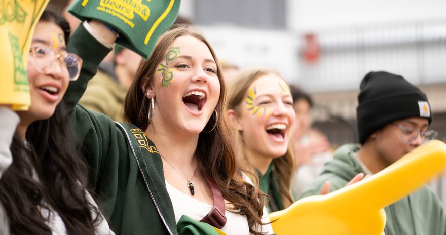 University of Alberta students cheering the athletics team at a match