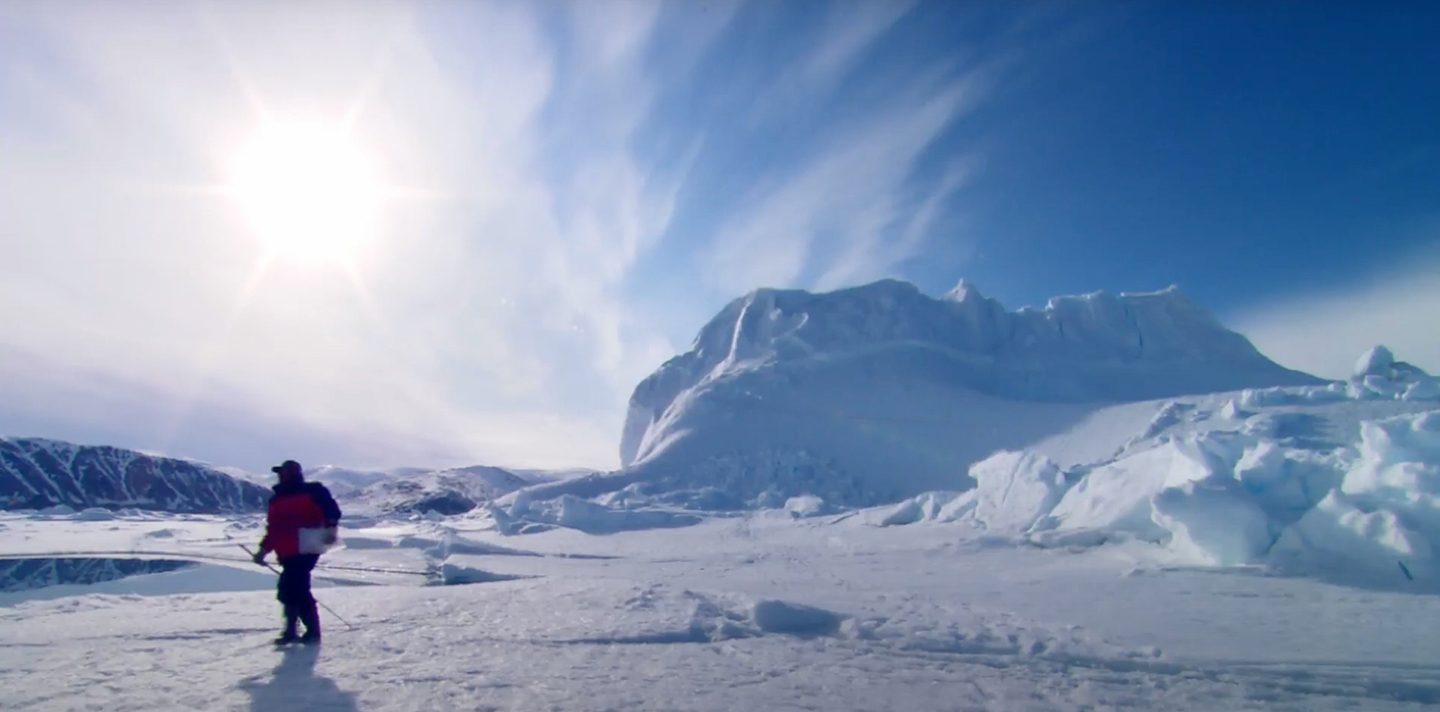 Snowy mountains with a person exploring it