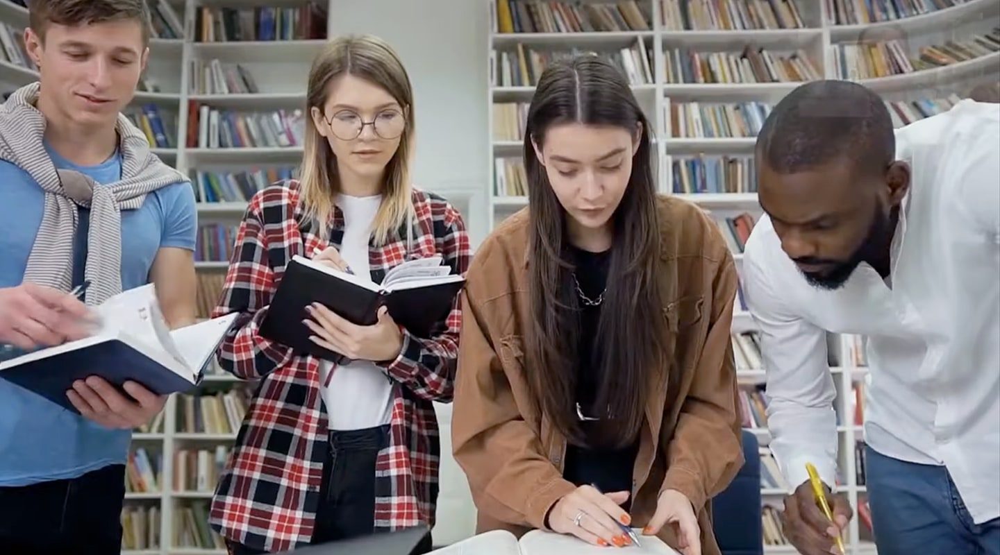 University students at the campus library revising their lecture notes