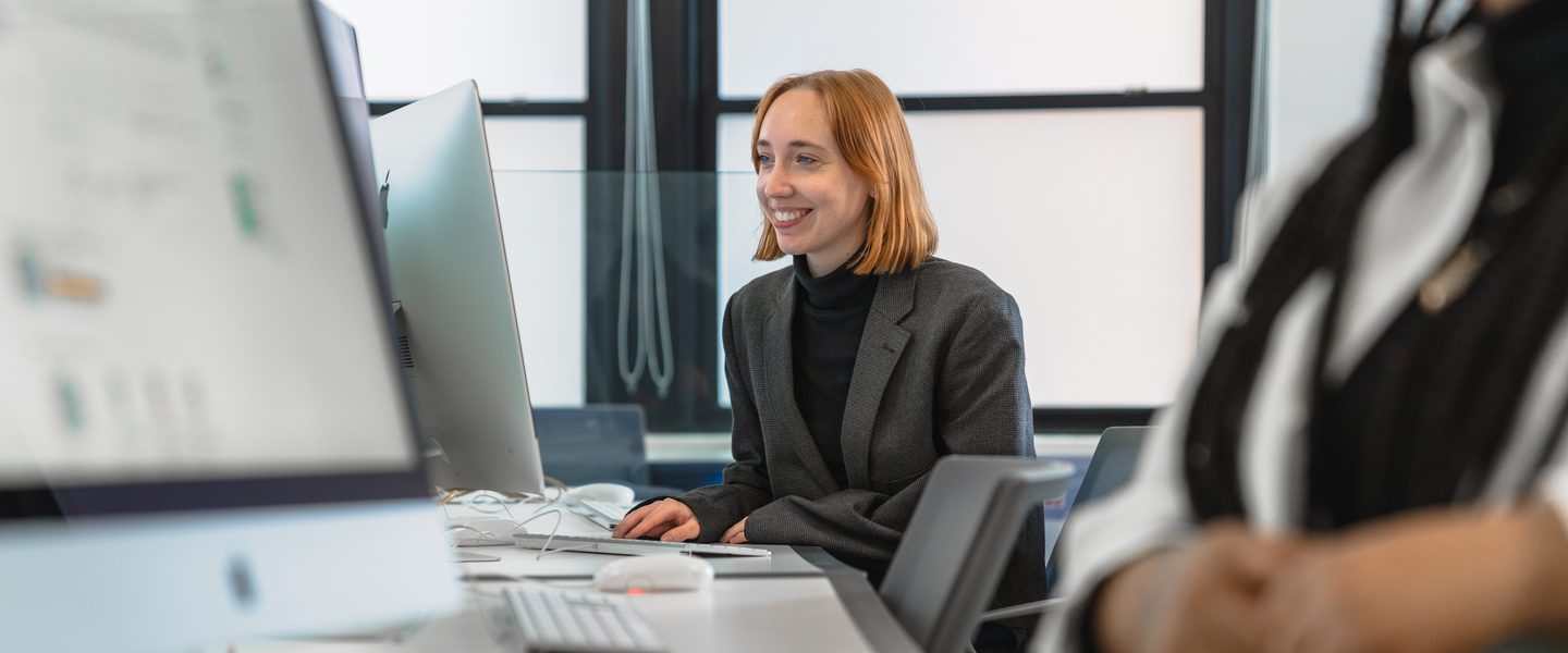 A shot of a Pace University student working on a computer