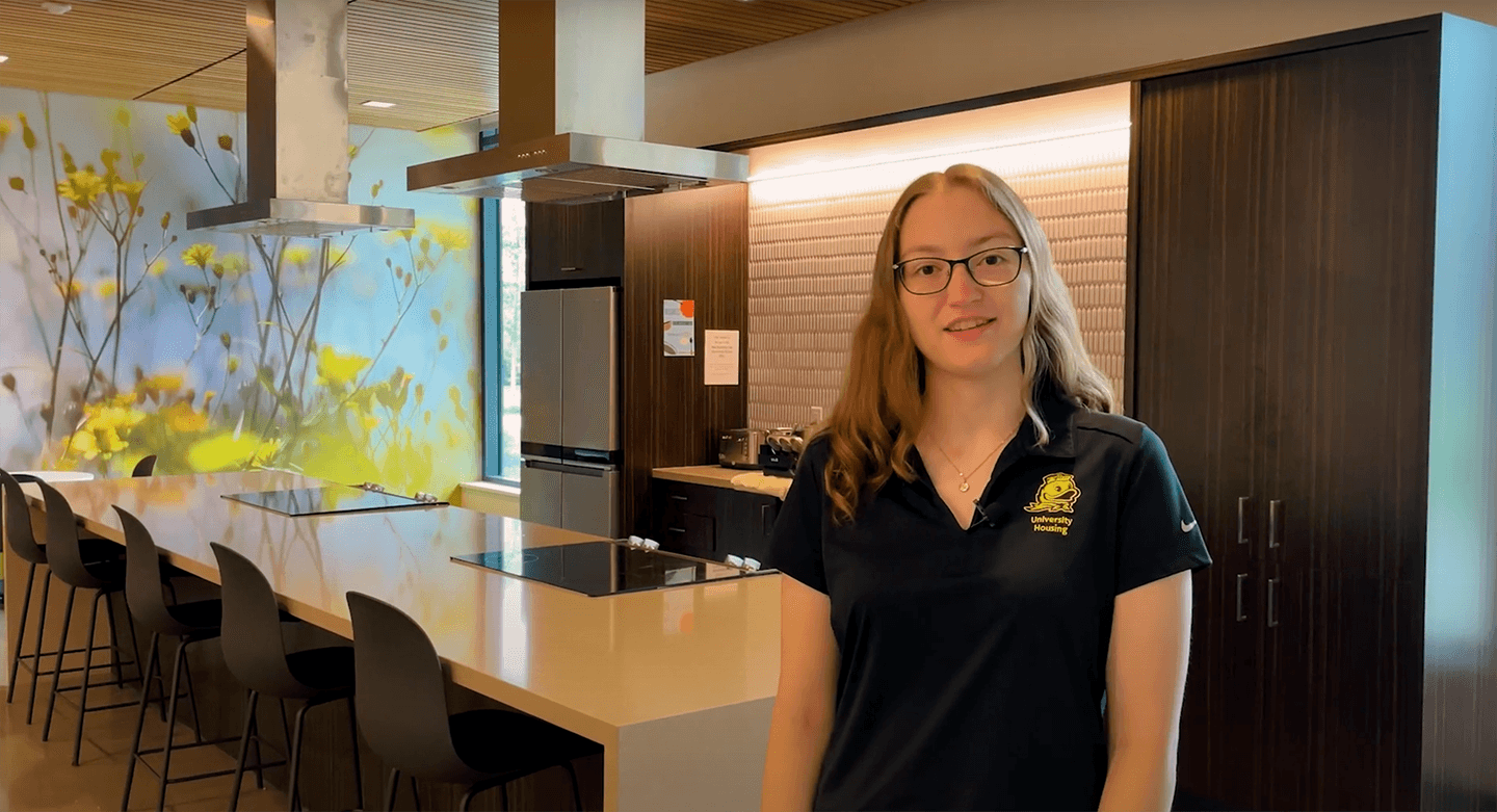 Student giving a tour of the UO residence hall