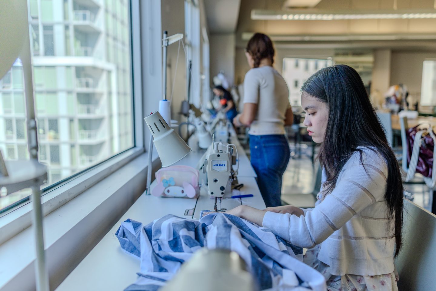 ASU FIDM student working on a drafting project