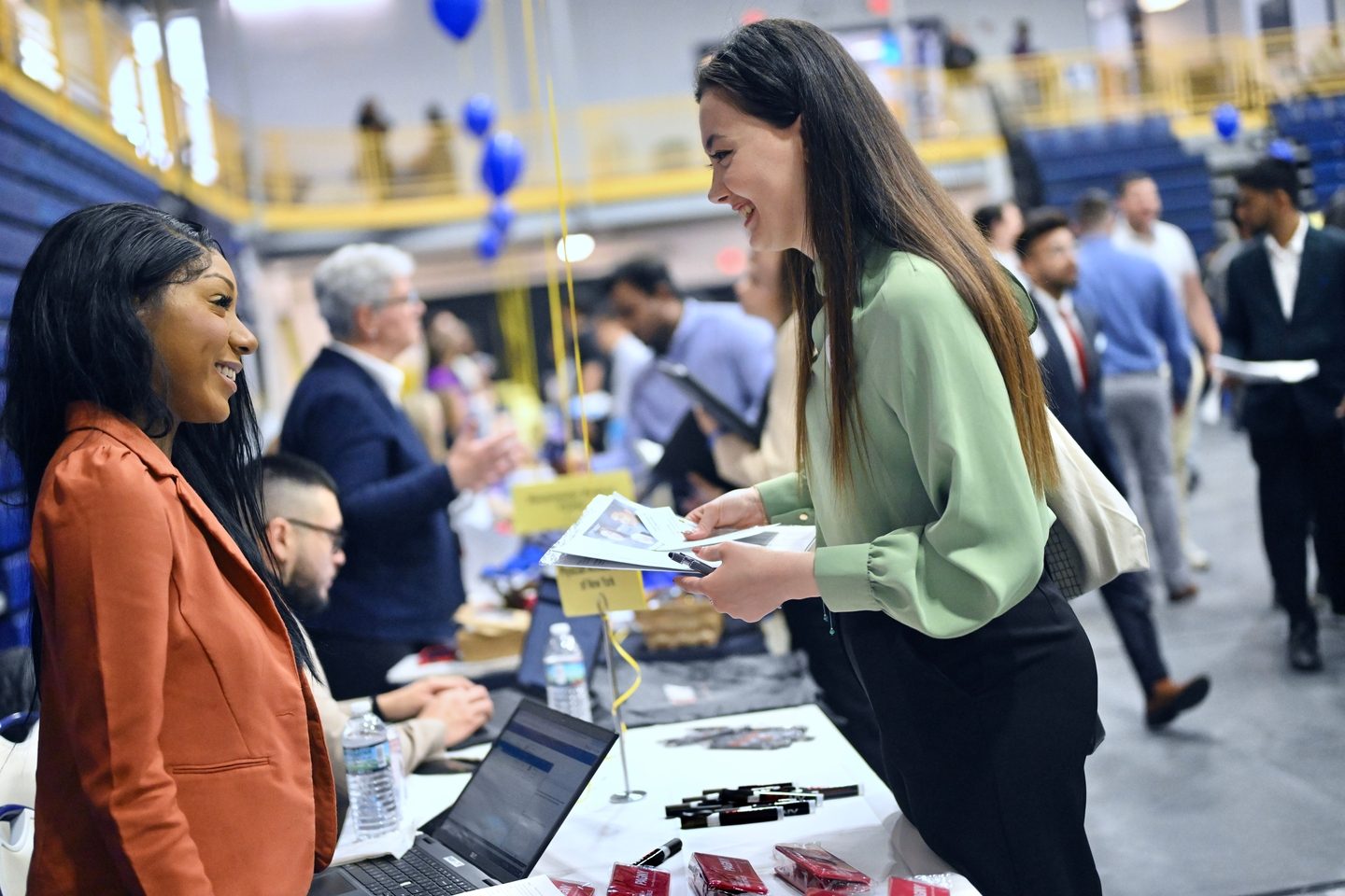 A international student finding out more about her study opportunities at a conference